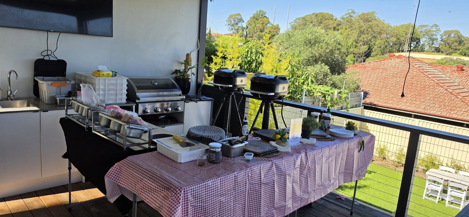Azzurri pizza catering setup on a République, Sydney rooftop terrace with twin mobile pizza ovens and BBQ station Azzurri pizza catering setup on a République, Sydney rooftop terrace with twin mobile pizza ovens and BBQ station