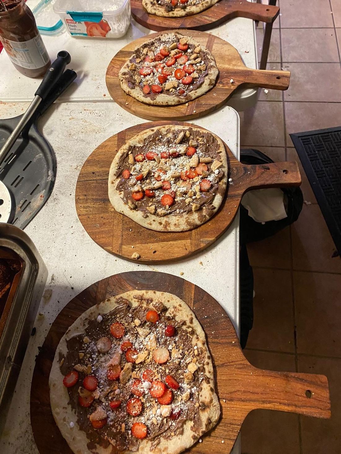 Sweet dessert pizzas with Nutella and fresh strawberries — Azzurri Pizza Catering signature dessert offering for weddings